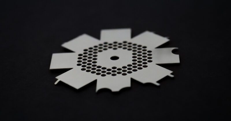 silver colored and nickel material photo etched part