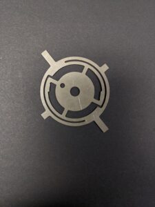 silver colored photo etched flat spring