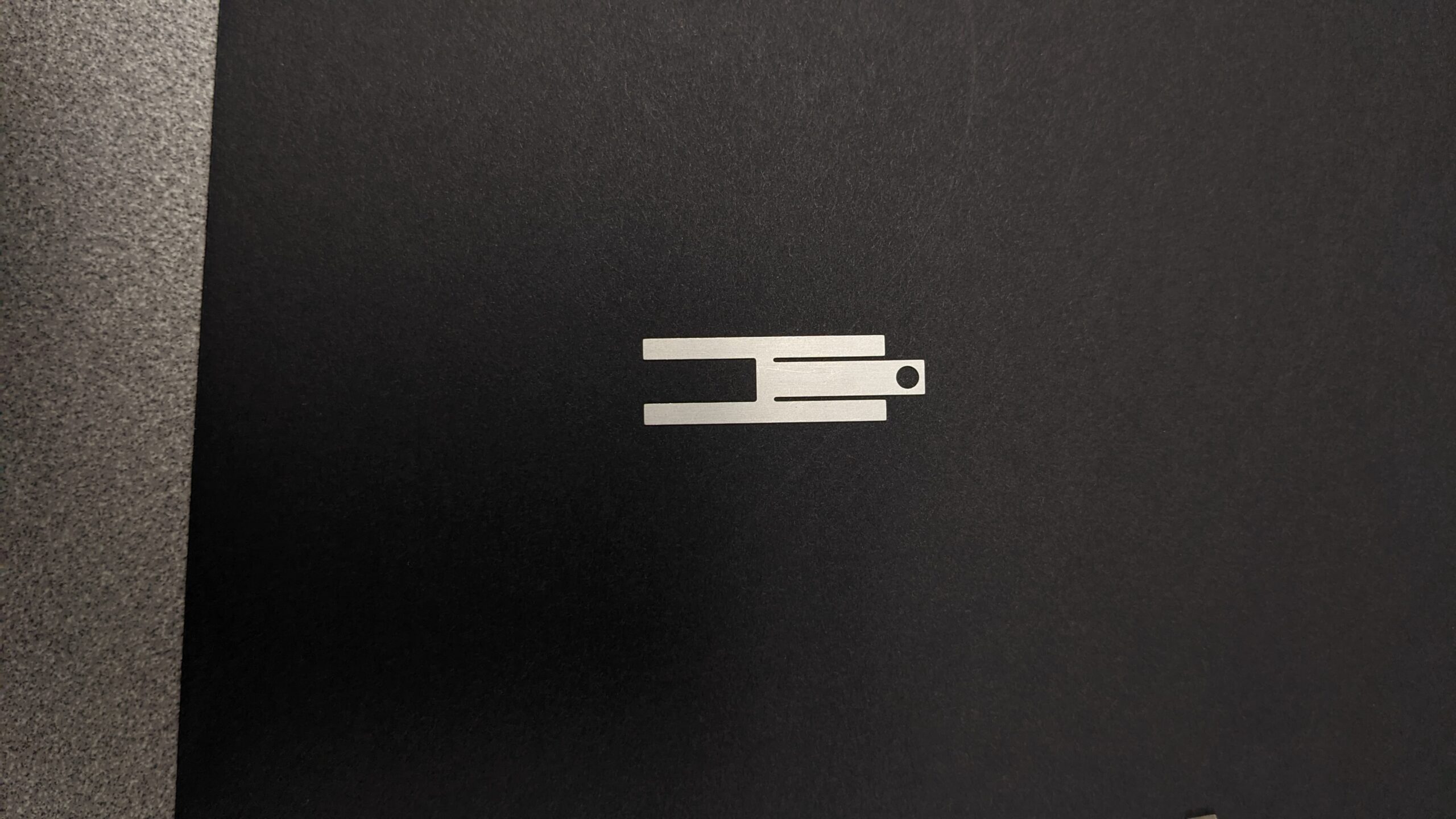 small and silver colored board level shielding photo etched part